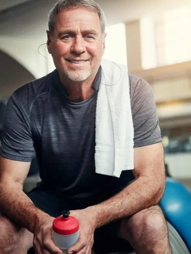 Confident, energized man at the gym — supported by TRT